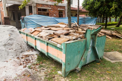 Professional team clearing out old furniture from a living room