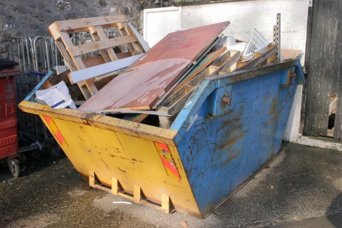 Professional junk removal team clearing garden waste
